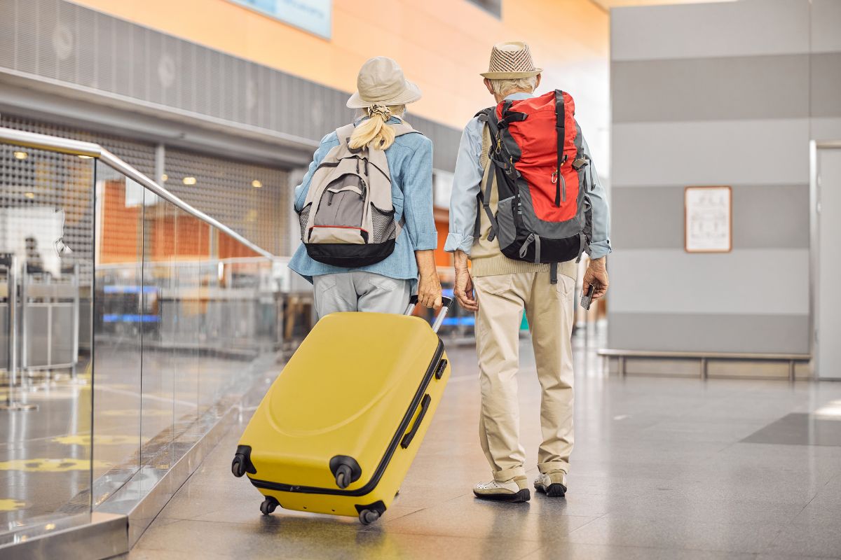 Medicare beneficiaries walking in an airport