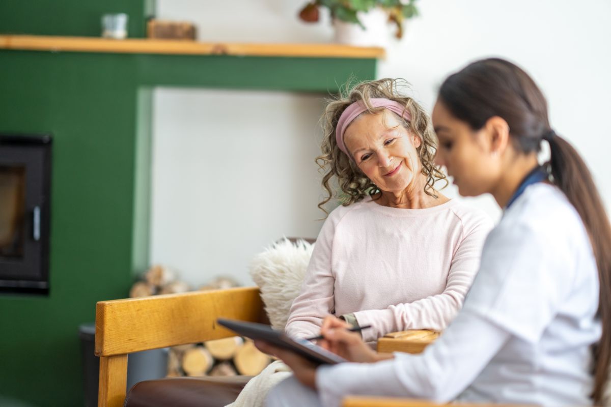 Provider explaining Medicare and Medicaid benefits to a woman